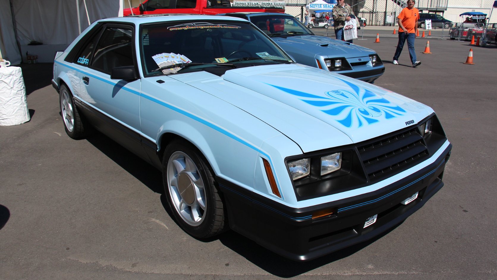 Light blue 1981 Ford Mustang Cobra hatchback with cobra hood graphic, front three-quarter view