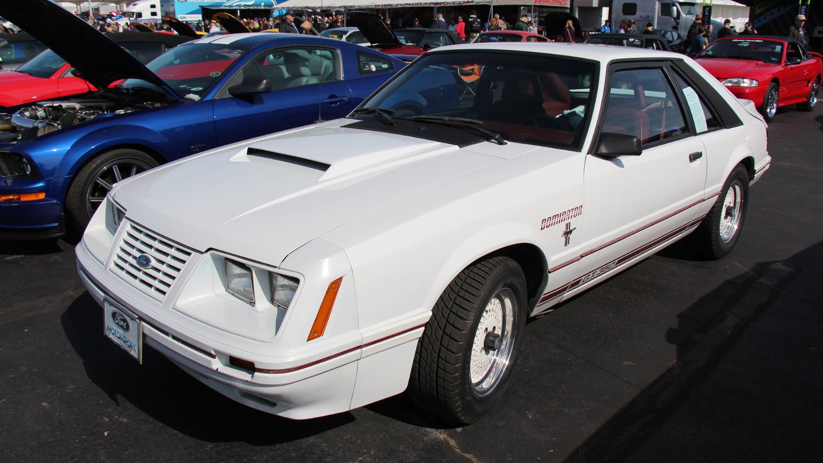 Oxford White 1984 Ford Mustang GT350 20th Anniversary hatchback with red rocker stripes